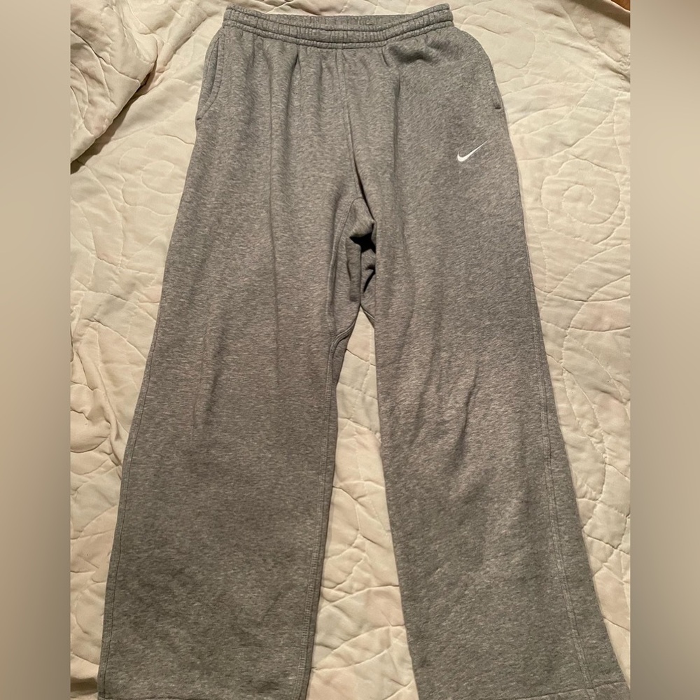 Light Gray Nike Sweats Size Large. 
*Hole in left pocket (shown in last picture)